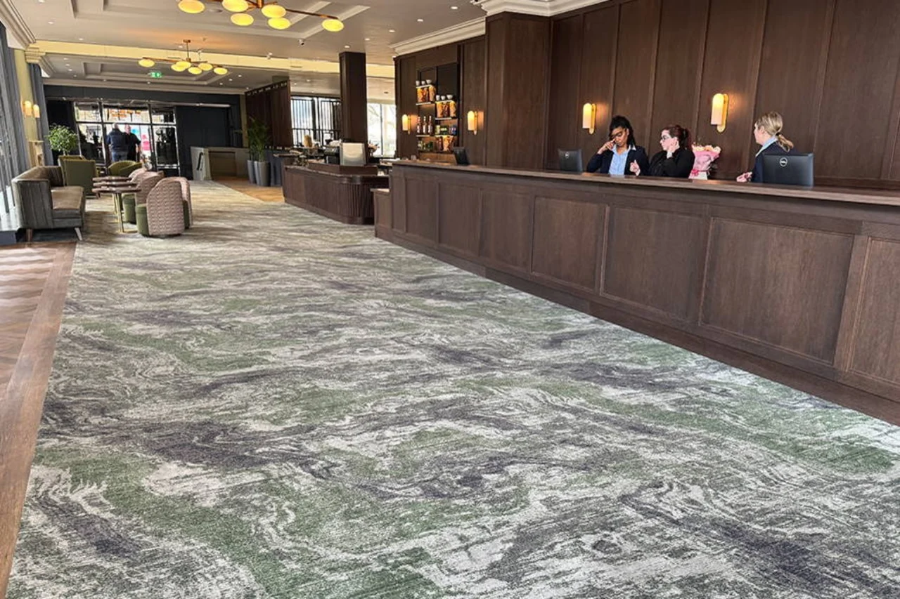 Patterned commercial carpet across a spacious hotel reception and seating area